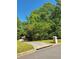 Beautiful driveway and private lot surrounded by mature trees in a lush natural setting at 7635 Blandford Pl, Atlanta, GA 30350