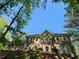 Traditional-style home with a well-manicured lawn and lush landscaping, perfect for curb appeal at 7635 Blandford Pl, Atlanta, GA 30350
