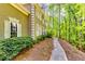 Home exterior with lush greenery and walkway offers a charming curb appeal at 7635 Blandford Pl, Atlanta, GA 30350