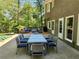 Back of house featuring a patio with dining and lounge areas, perfect for outdoor enjoyment at 7635 Blandford Pl, Atlanta, GA 30350