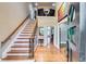 Grand foyer with a staircase, hardwood floors, and natural light pouring in at 7635 Blandford Pl, Atlanta, GA 30350