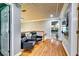 Bright hallway features hardwood floors, sleek black seating, and easy access to other rooms at 7635 Blandford Pl, Atlanta, GA 30350