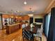 Eat-in kitchen features stainless steel appliances, wood cabinets, and a kitchen island with granite countertops at 7635 Blandford Pl, Atlanta, GA 30350