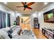 Stylish living room with a cozy couch, hardwood floors, and natural light streaming in at 7635 Blandford Pl, Atlanta, GA 30350
