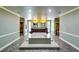 Luxurious Primary bath featuring a soaking tub and double vanity sinks with large mirrors at 7635 Blandford Pl, Atlanta, GA 30350
