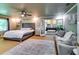 Spacious main bedroom with a seating area and a view into the ensuite bathroom at 7635 Blandford Pl, Atlanta, GA 30350