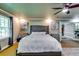Serene main bedroom features a plush king bed, decorative art, and soft lighting for a peaceful retreat at 7635 Blandford Pl, Atlanta, GA 30350