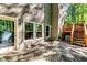 Patio featuring access to a stairway leading to a deck, and access to the home through sliding glass doors at 7635 Blandford Pl, Atlanta, GA 30350