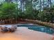 Inviting backyard pool area with outdoor seating, perfect for relaxation and entertaining guests at 7635 Blandford Pl, Atlanta, GA 30350