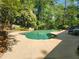 Inviting pool area surrounded by lush greenery, perfect for relaxation and outdoor entertaining at 7635 Blandford Pl, Atlanta, GA 30350