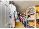 Well-organized walk-in closet featuring shelving, hanging space, and storage solutions at 7635 Blandford Pl, Atlanta, GA 30350