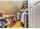 Large walk-in closet with ample shelving, hanging space, and storage for clothes and shoes at 7635 Blandford Pl, Atlanta, GA 30350