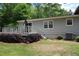 Rear view of a back deck with patio furniture and shade umbrella at 2977 Karen Ln, Marietta, GA 30062