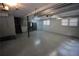 Unfinished basement with painted floor, white walls, and access to stairs at 2977 Karen Ln, Marietta, GA 30062