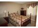 Bedroom features a bed, dresser, and a large window for natural light at 2977 Karen Ln, Marietta, GA 30062