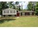 Charming two-story home with landscaped yard and a vibrant red front door at 2977 Karen Ln, Marietta, GA 30062