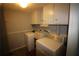 A functional laundry room includes a washer and dryer setup with ample storage at 2977 Karen Ln, Marietta, GA 30062