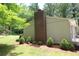 Mature landscaping defines the side of this home with brick chimney at 2977 Karen Ln, Marietta, GA 30062