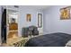 Comfortable bedroom featuring an accent rug and a dark-colored desk area at 1445 Monroe Ne Dr # E25, Atlanta, GA 30324