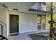 Charming entry door, complimented by a cozy outdoor patio and mature landscaping at 1445 Monroe Ne Dr # E25, Atlanta, GA 30324