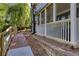 Condominium exterior featuring screened porches, manicured grounds, and walking paths at 1445 Monroe Ne Dr # E25, Atlanta, GA 30324