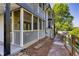 Condominium exterior featuring screened porches, manicured grounds, and walking paths at 1445 Monroe Ne Dr # E25, Atlanta, GA 30324