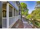 Screened in porch with walkway, offering a charming outdoor living space and lush greenery at 1445 Monroe Ne Dr # E25, Atlanta, GA 30324