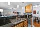 Kitchen sink with stainless steel appliances with a view into the living and dining areas at 1445 Monroe Ne Dr # E25, Atlanta, GA 30324
