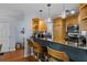 Granite countertops and stylish bar stools define this modern kitchen at 1445 Monroe Ne Dr # E25, Atlanta, GA 30324
