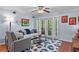 Cozy living room with a comfortable sofa, unique decorations and sliding glass doors at 1445 Monroe Ne Dr # E25, Atlanta, GA 30324