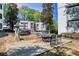 Outdoor patio with seating near a decorative fountain offering a relaxing community gathering space at 1445 Monroe Ne Dr # E25, Atlanta, GA 30324