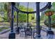 Gazebo with table and seating, providing an elegant outdoor space surrounded by landscaping at 1445 Monroe Ne Dr # E25, Atlanta, GA 30324