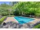 Community pool surrounded by lounge chairs, perfect for relaxation and outdoor enjoyment at 1445 Monroe Ne Dr # E25, Atlanta, GA 30324