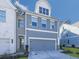Inviting two-story home featuring a two-car garage, gray siding, and neatly landscaped front yard at 1020 Broadview Dr, Marietta, GA 30062
