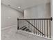 Carpeted staircase with dark wood railing, offering a transition between floors at 1020 Broadview Dr, Marietta, GA 30062