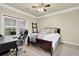 Cozy bedroom featuring a ceiling fan, window, and comfortable furnishings, perfect for relaxation at 1850 Cotillion Dr # 3307, Atlanta, GA 30338