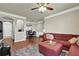 Spacious living room with hardwood floors, plush rug, and open layout to dining area and kitchen at 1850 Cotillion Dr # 3307, Atlanta, GA 30338