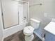 Bathroom featuring a shower with sliding glass door, toilet, and tile floors at 210 Meadowbrook Dr, Mcdonough, GA 30253