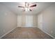 Spacious bedroom with ceiling fan and plush carpet offers plenty of natural light at 210 Meadowbrook Dr, Mcdonough, GA 30253