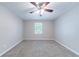 A cozy bedroom features plush carpet, neutral walls, and a ceiling fan at 210 Meadowbrook Dr, Mcdonough, GA 30253