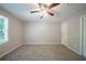 Bedroom with ceiling fan, plush carpet, and neutral walls at 210 Meadowbrook Dr, Mcdonough, GA 30253