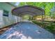 Spacious carport for vehicle protection with concrete slab and a connection to the home at 210 Meadowbrook Dr, Mcdonough, GA 30253