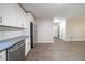 Modern kitchen with stainless appliances, subway tile backsplash, durable counters, and vinyl plank flooring at 210 Meadowbrook Dr, Mcdonough, GA 30253