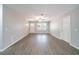 Light-filled living room with luxury vinyl plank flooring, neutral paint, and ceiling fan at 210 Meadowbrook Dr, Mcdonough, GA 30253