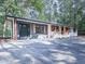Charming house featuring a modern brick exterior, dark shutters, and stylish front door at 221 Wonewok Dr, Canton, GA 30114