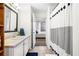 This bathroom features tiled floors, a framed mirror, and a shower with patterned shower curtain at 1101 Juniper Ne St # 1519, Atlanta, GA 30309