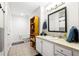 This bathroom features tiled floors, a framed mirror, and a light wood bookcase at 1101 Juniper Ne St # 1519, Atlanta, GA 30309