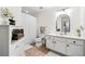 This bathroom features tiled floors, a framed mirror, and a white sink vanity at 1101 Juniper Ne St # 1519, Atlanta, GA 30309