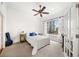 This bedroom features carpeted floors, a ceiling fan, and a beautiful window with cityscape views at 1101 Juniper Ne St # 1519, Atlanta, GA 30309