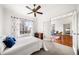 This bedroom features carpeted floors, a ceiling fan, and glass french doors at 1101 Juniper Ne St # 1519, Atlanta, GA 30309